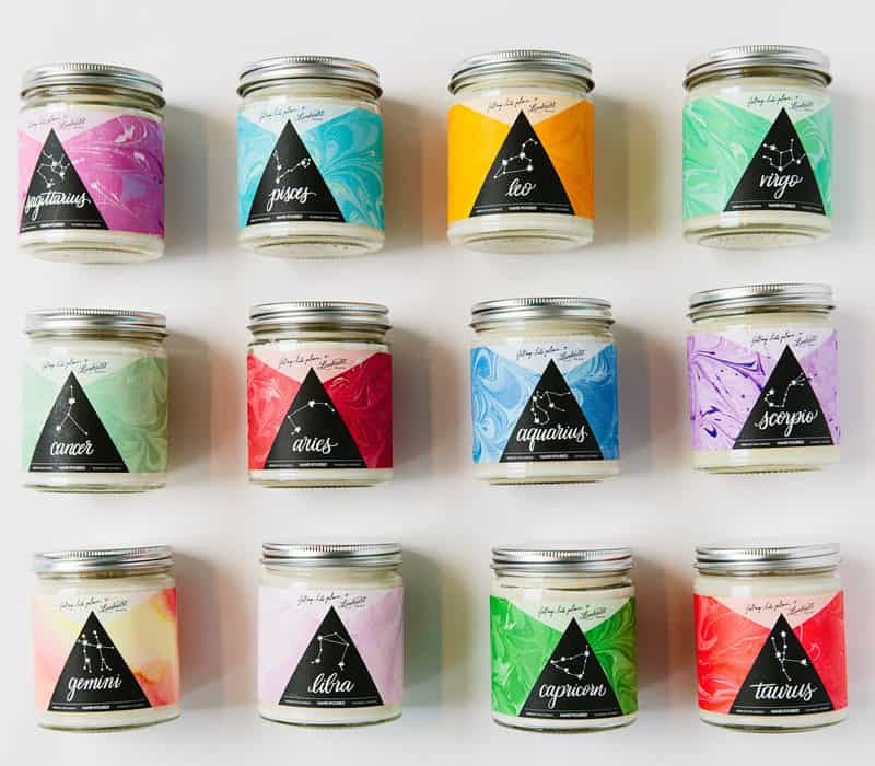 Collection of Falling Into Place astrology-themed candles.