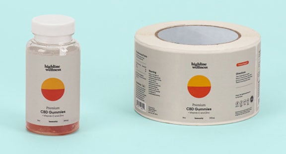 Highline Wellness CBD Gummies next to a roll of their corresponding labels.